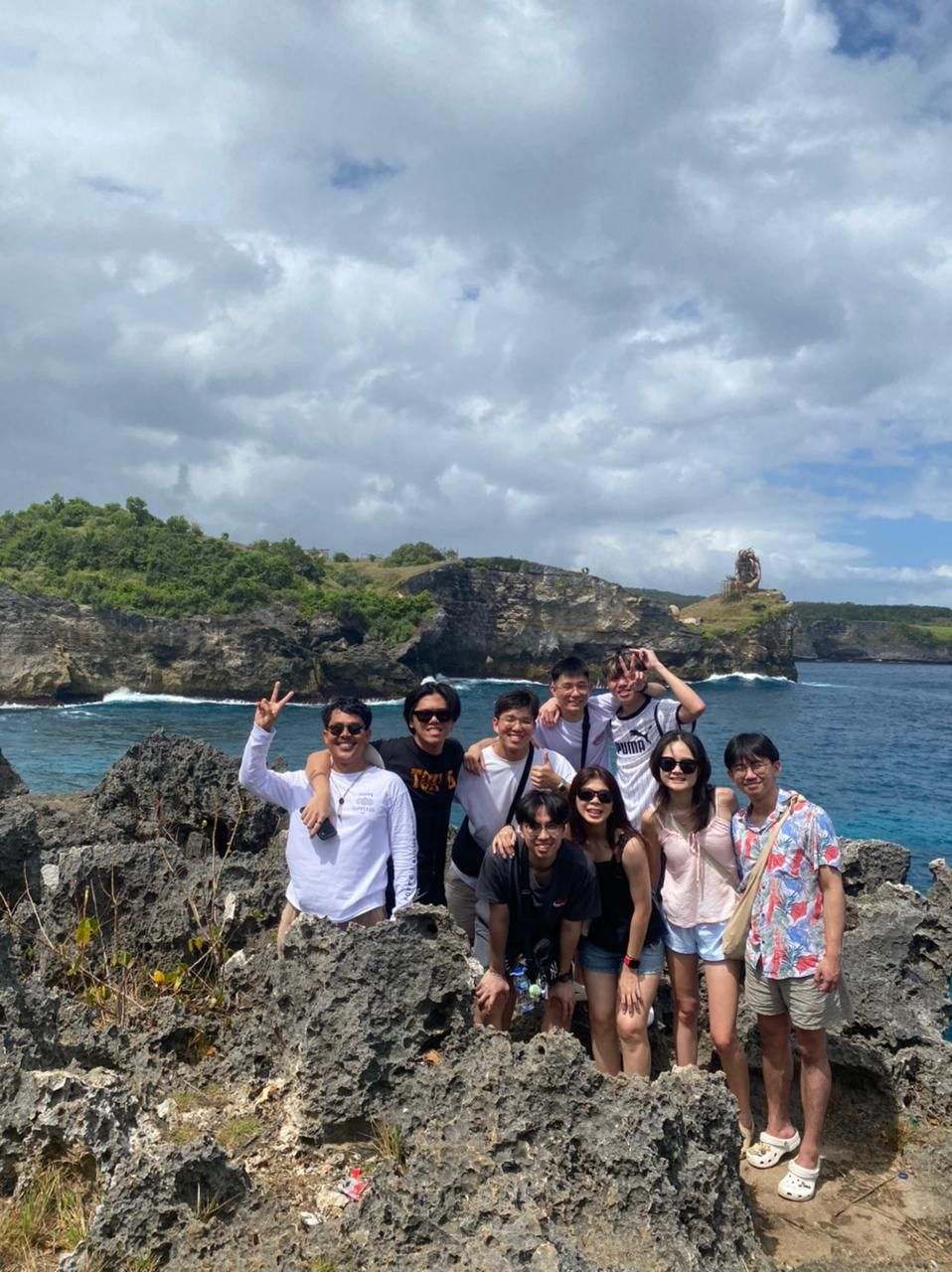 Group of guests on the rocks at Nusa Penida