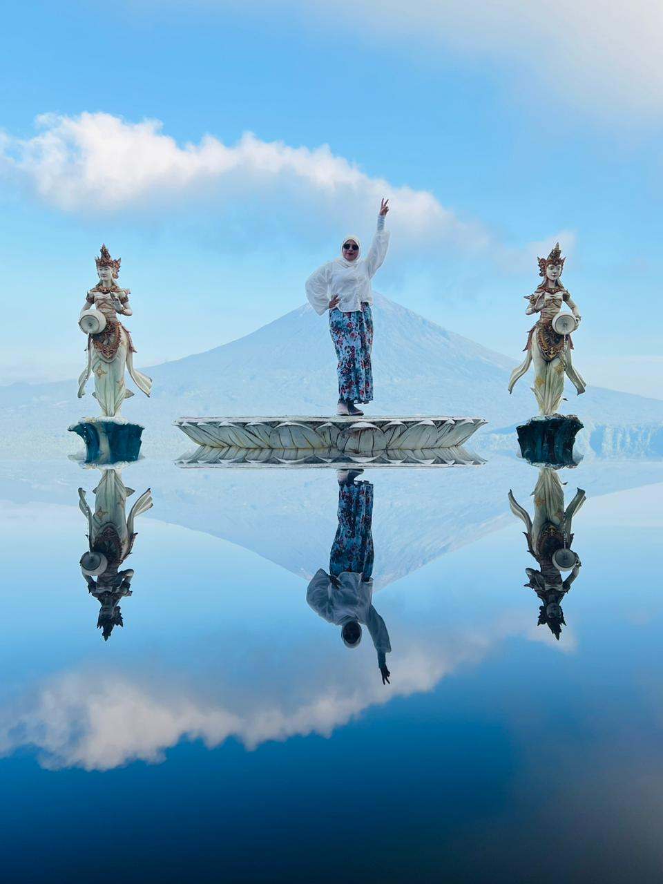 Guest on the mirror reflection photo spot under blue sky