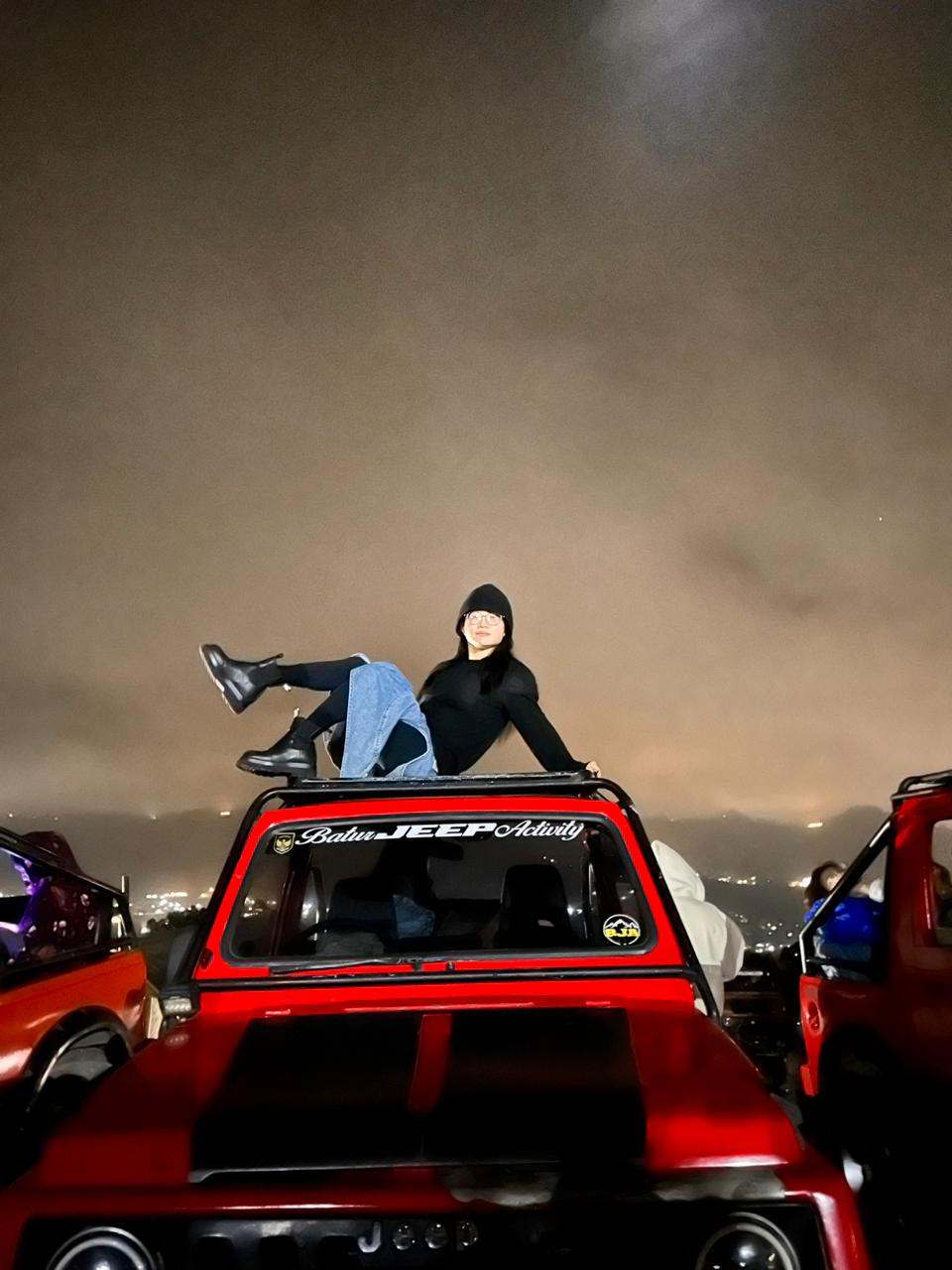 Guest on a red jeep before dawn, Mount Batur